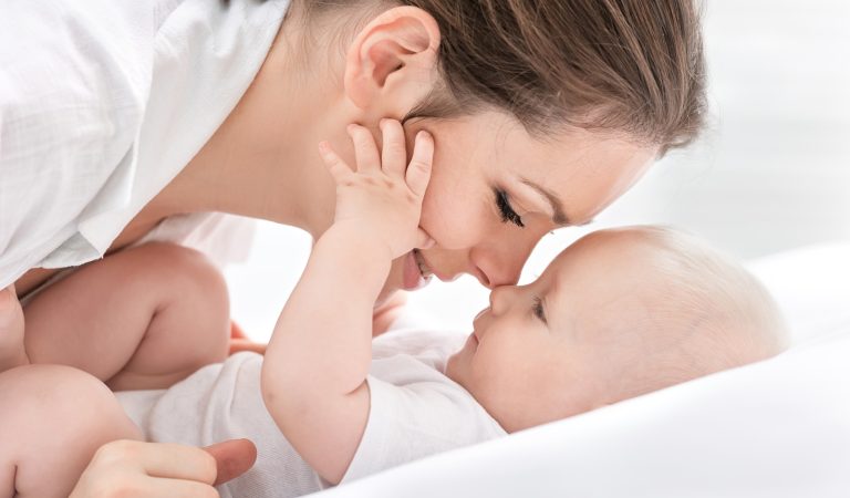 Portrait of happy mother and baby